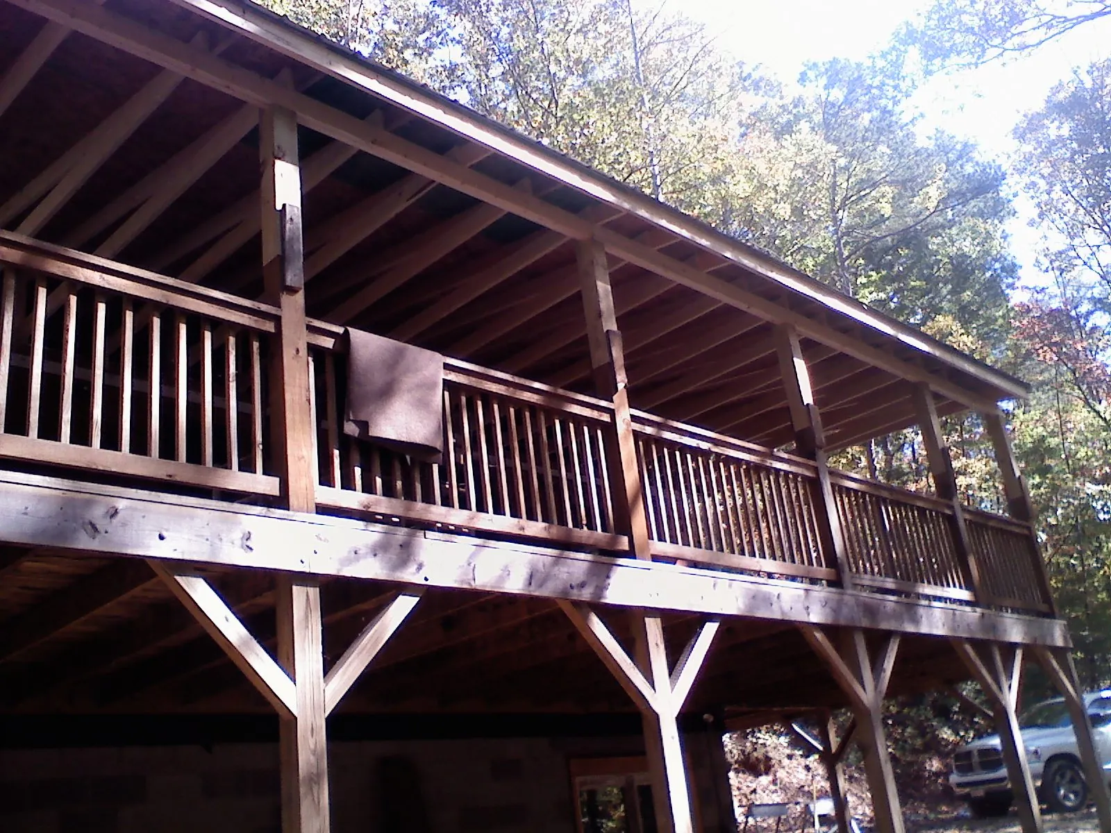 Timber framing under a new elevated porch and deck in Dorena